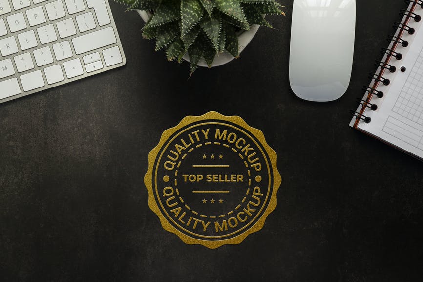 Gold Logo Mockup – Dark desk top view AJXKGYA